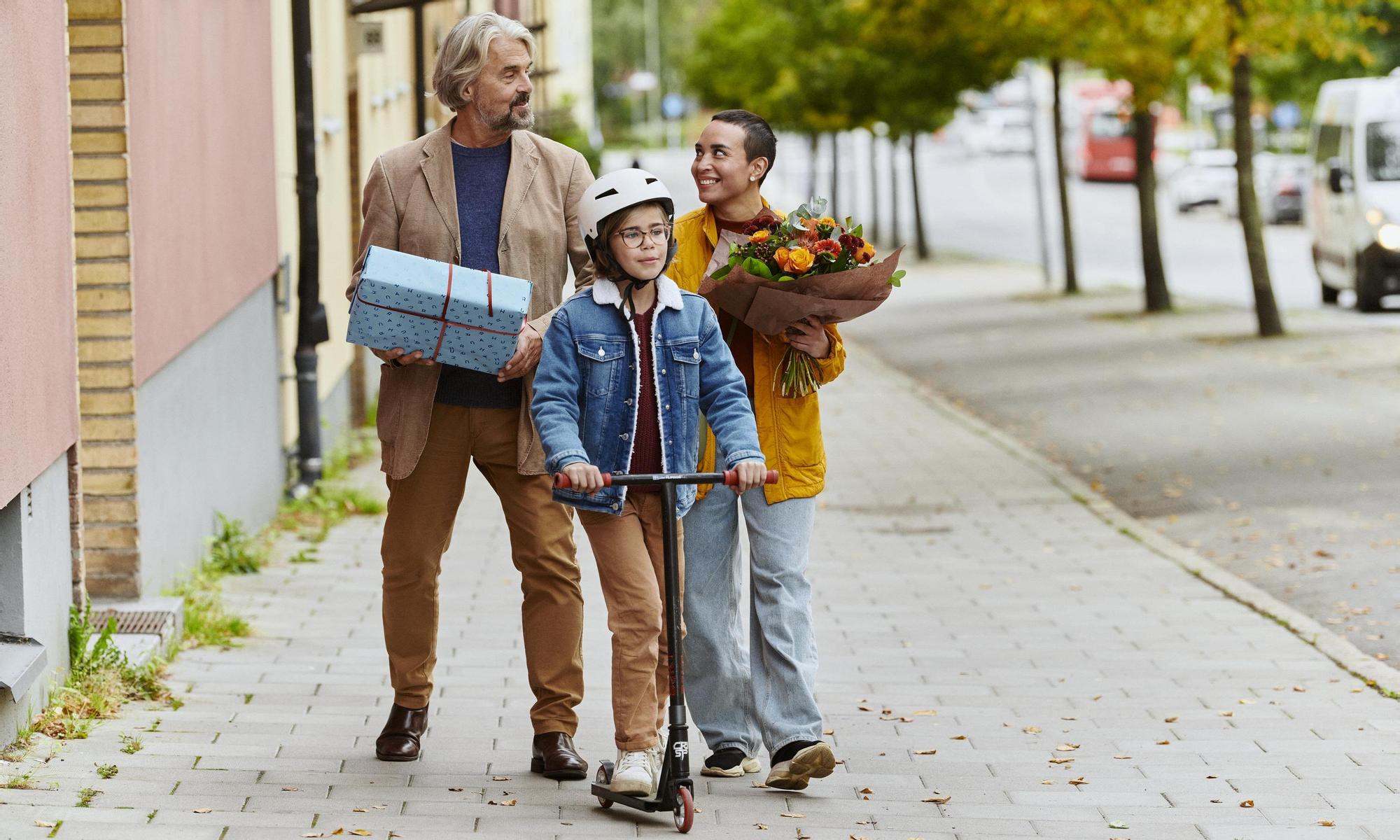 A family of three going to a birthday party